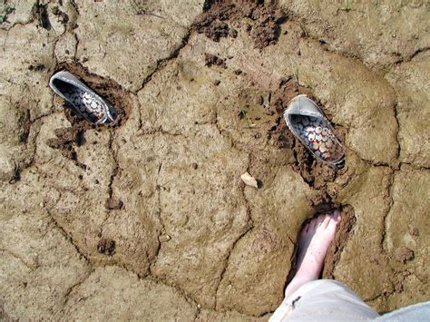 shoes stuck in mud.